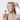 Model applying a pipette of AGELESS total pure hyaluronic filler from IMAGE Skincare Canada to her cheek while also holding up the product in her other hand.